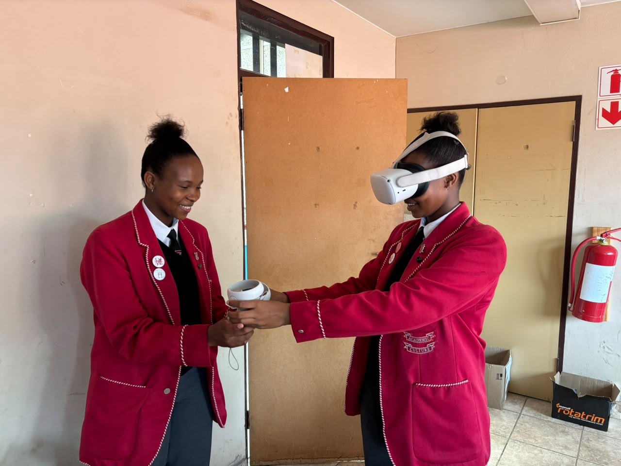 Learners using virtual reality controllers and headset